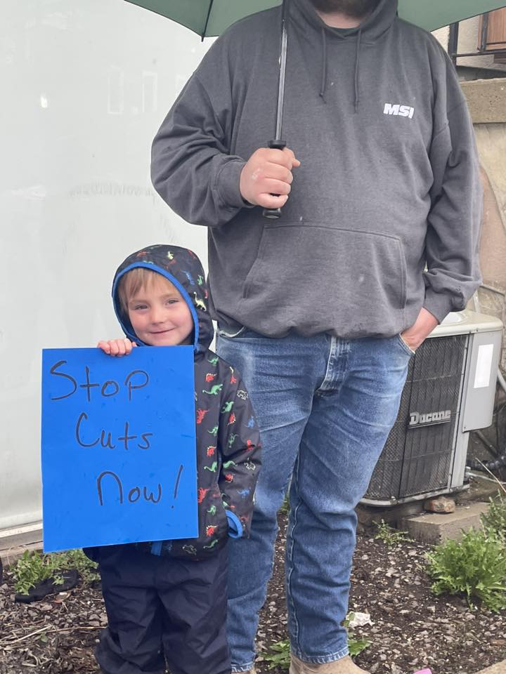 Stop Cuts Now with little person